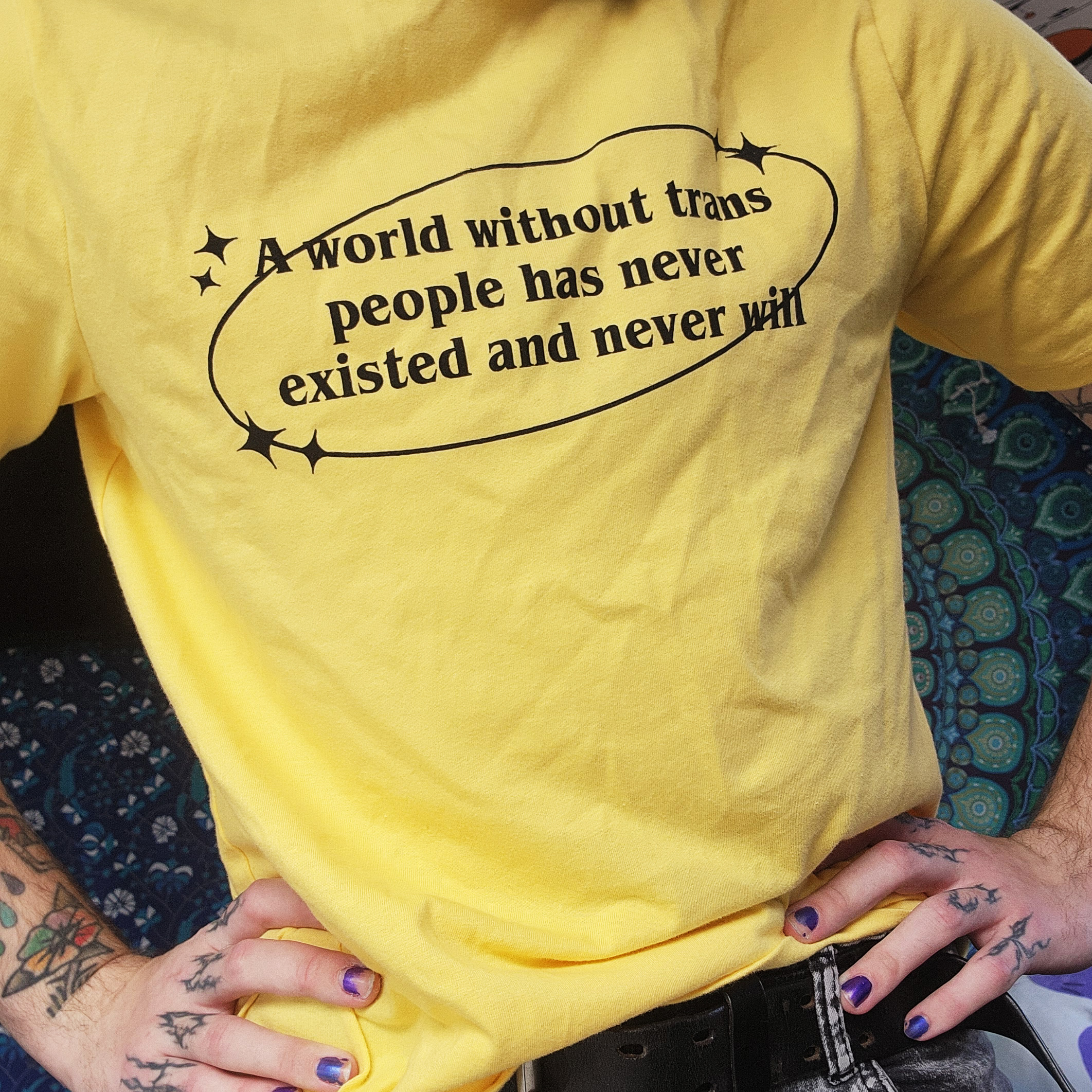 person wearing a handmade black and neon green hoodie with bunny ears and a painted bunny face design, holding the ears on the hood over their face outdoors at dusk